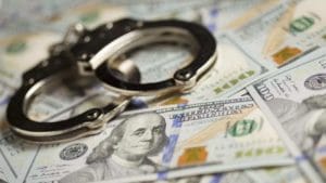 dollars and handcuff